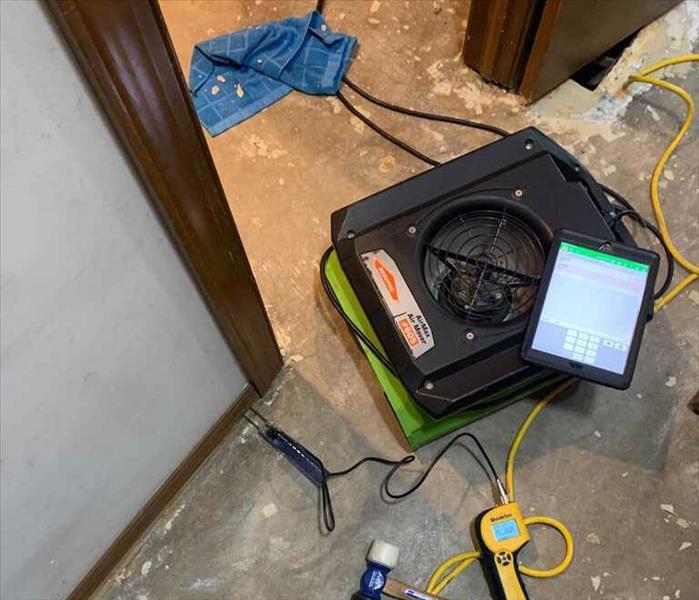 Air mover on a concrete floor.